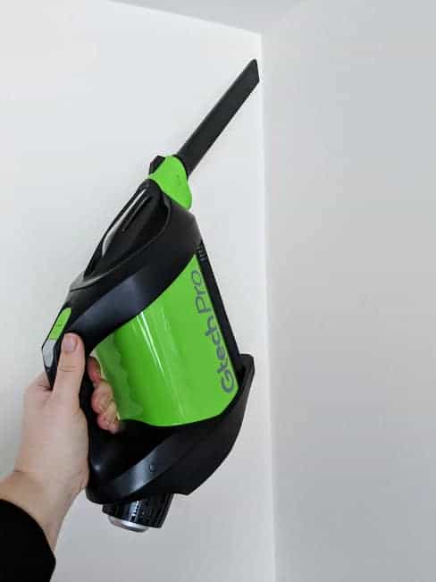 Hoovering a white wall with Gtech Pro