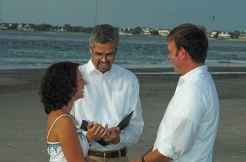 Officiant marrying a couple on the beach. Wedding dinner cruise Charleston SC