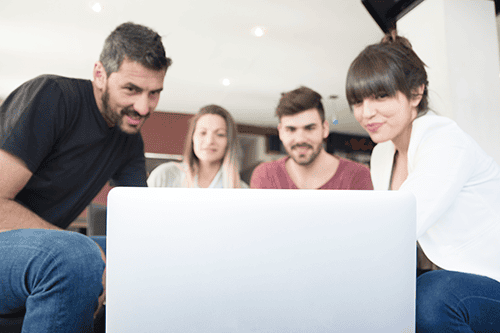 group-friends-looking-laptop