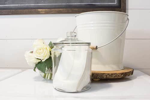 Organize a tiny laundry room: make storage cute and functional with pretty jars and pails. 