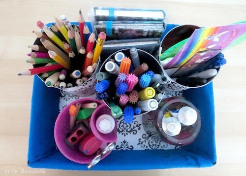 Colored pencil storage ideas: upcycle a cardboard box and empty cans into a cute, customized pencil storage station.