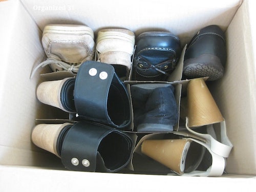 Organize shoes in a divided cardboard wine box.