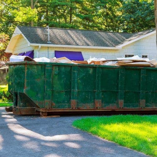 Declutter your garage by throwing out all trash. If it's really cluttered, consider renting a dumpster.