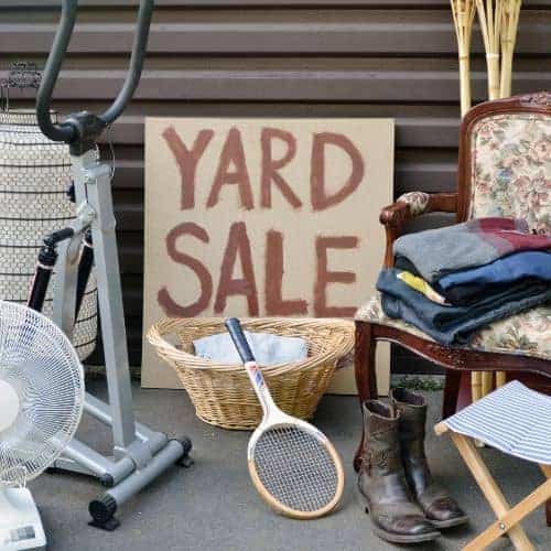 Declutter your garage by holding a yard sale.