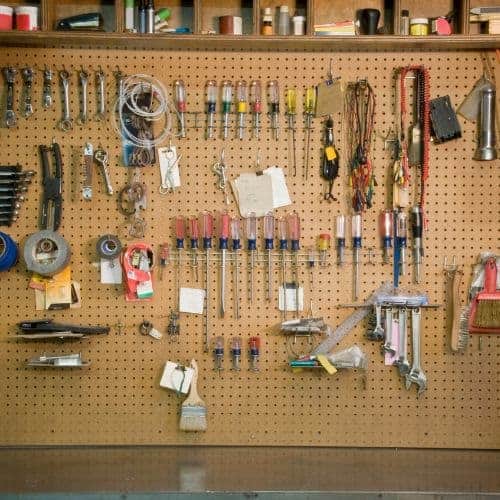 Organize tools on a pegboard