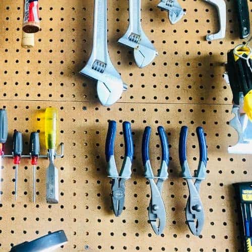 Organize tools on a pegboard: plier holders