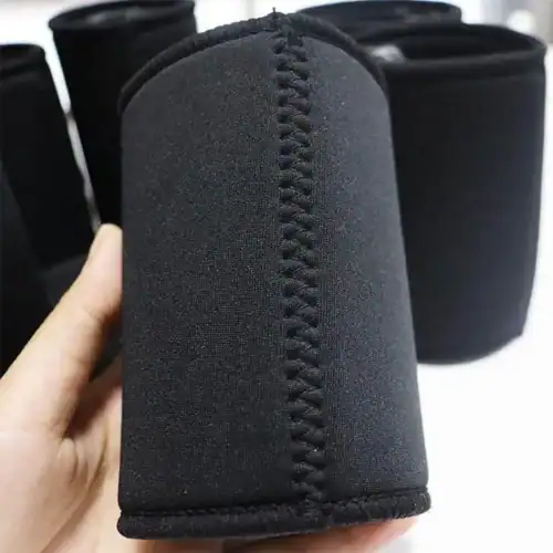 Stubby Holder in Black, angle view, hand holding
