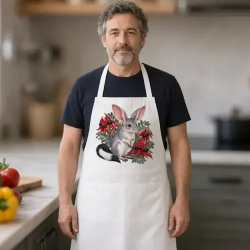 Lifestyle photo of the Bilby Among Sturt Desert Peas Apron being worn or used