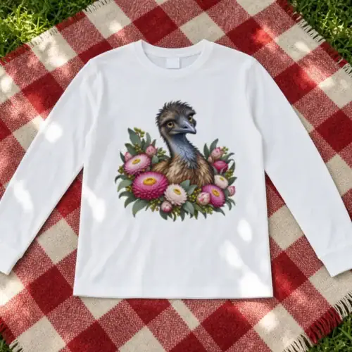 White Elegant Emu with Everlasting Daisies kids long sleeve T-shirt laid flat on a red-and-cream checked wool rug on the grass