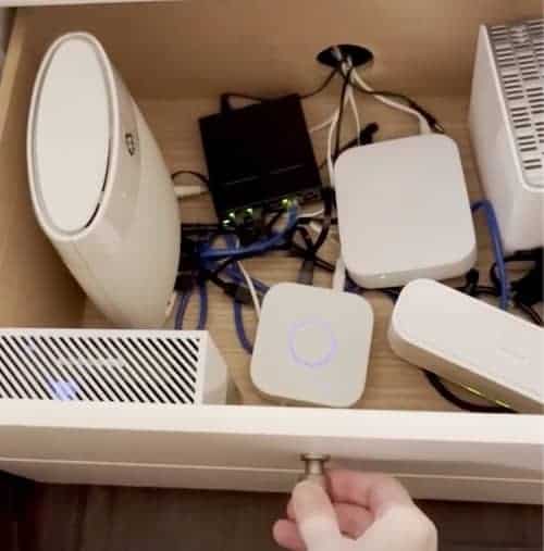 Under desk storage ideas: hide modems, routers and smart home hubs in a bottom desk drawer or filing cabinet. 