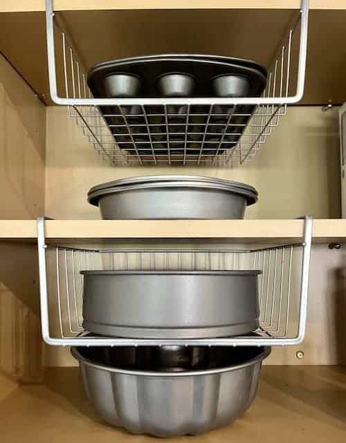 Organize baking supplies with under shelf baskets in a pantry or cabinet