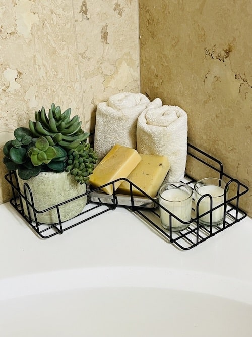 Small bathroom organizing: corner caddy on the bathtub
