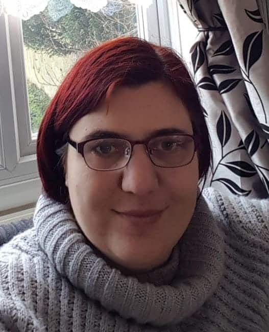 Jen smiling as a domestic abuse survivor