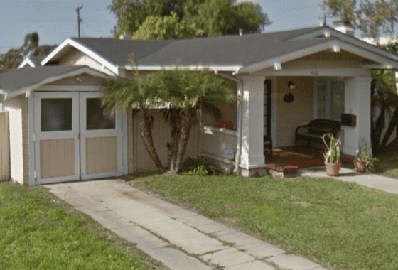 Craftsman home at 3602 Villa Terrace in North Park featuring a spacious front porch, double-door detached garage, and lush palm trees.