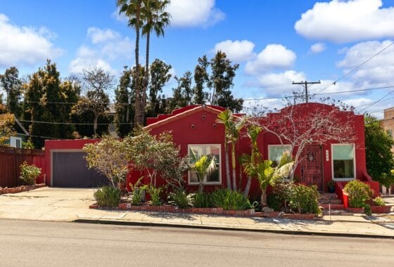 front of spanish style home in north park with red brick exterior and drought tolerant landscape