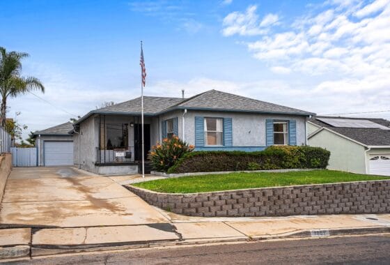 Exterior of a classic 1950s single-family home at 1751 39th Street in Fairmont Park San Diego, featuring a landscaped front lawn and long driveway.