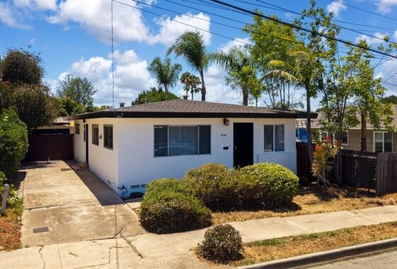 north park mid century home with exterior white walls and black trim