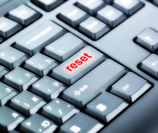 Image of a computer keyboard with a "reset" button to help singles get over their past relationships.