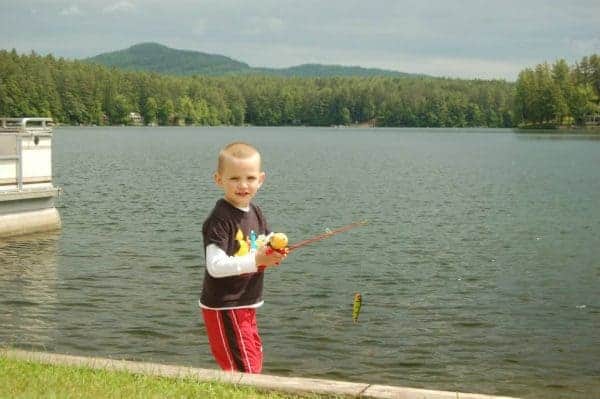 little boy fishing ridin hy