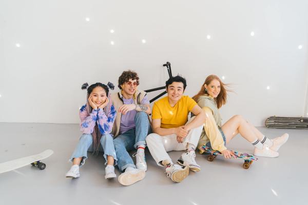 a group of people smiling while sitting on the floor