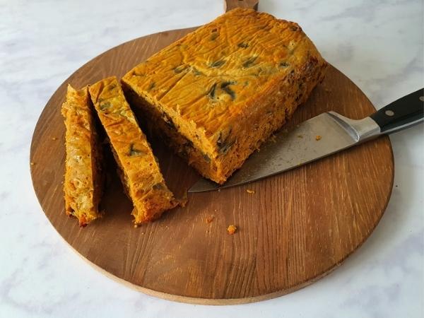 sliced curry loaf on a wooden board