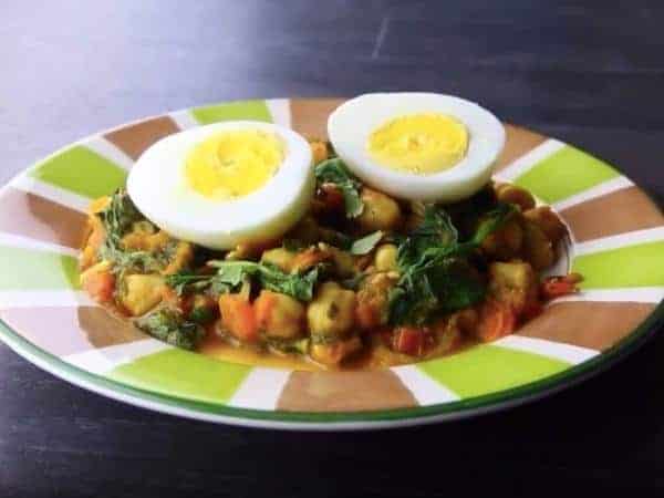 spanish chickpeas on a bright coloured plate.