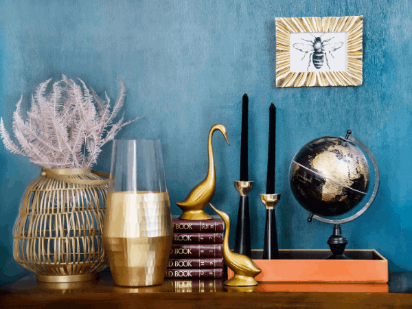 Sideboard with various trinkets including globe and vase