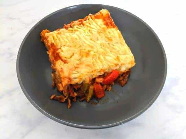 Cowboy pie on black plate on marble background