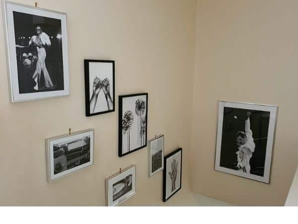 Various framed pieces of wall art on the wall