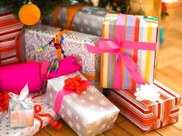 An array of Christmas gifts with multicoloured paper and ribbons