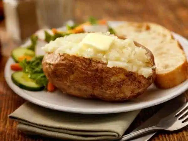 jacket potato on plate with salad