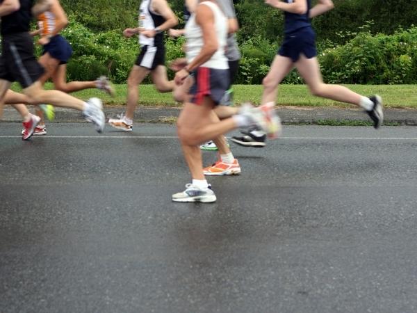 running people on a road