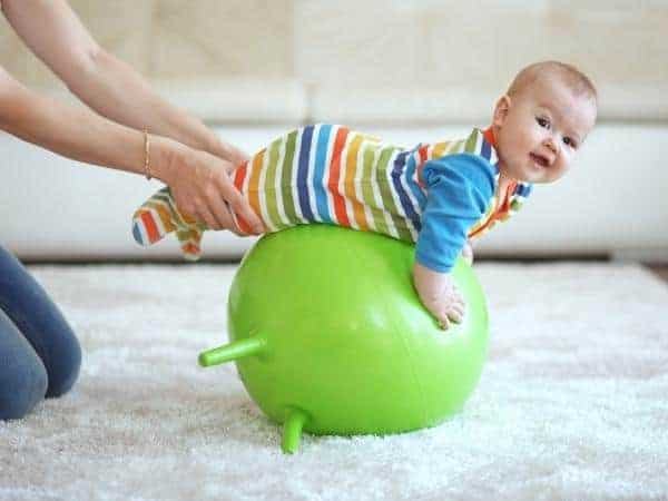 baby on bouncing ball
