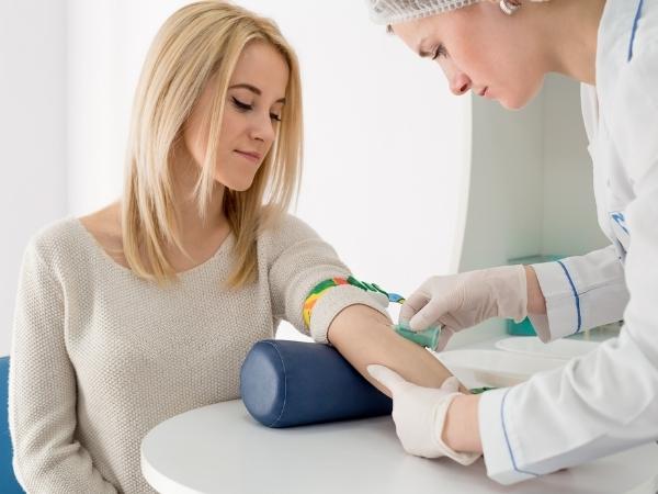 Blood test being done on a lady by a female doctor
