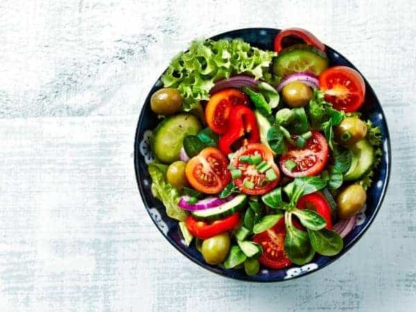 salad bowl with bright coloured vegetables in.