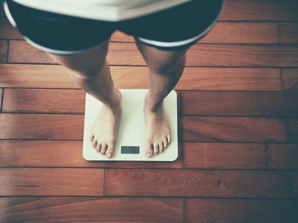 bathroom scales with a lady's feet
