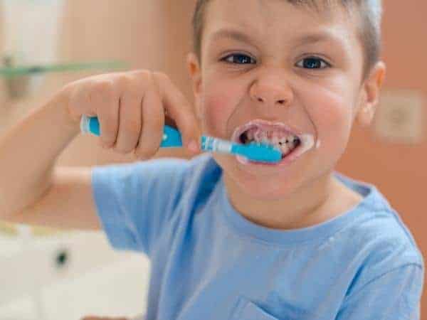 boy brushing teeth