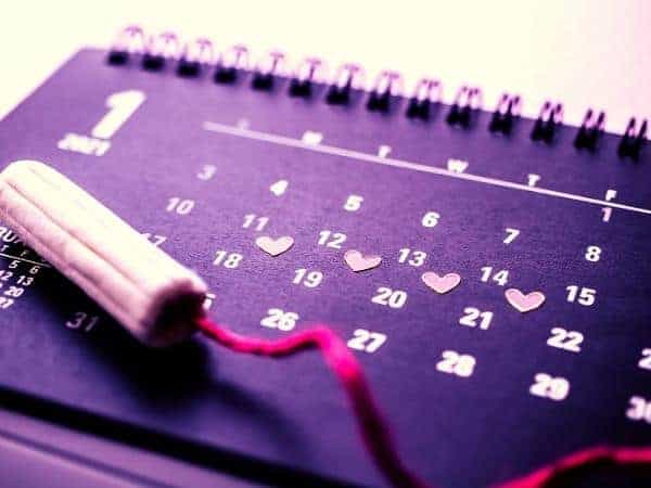 Calendar with tampon on top