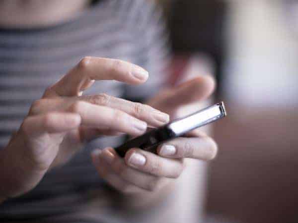 ladies hands holding a smart phone