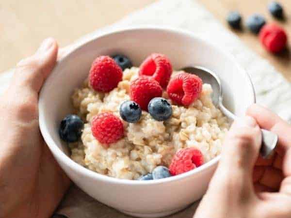 bowl of porridge with berries in