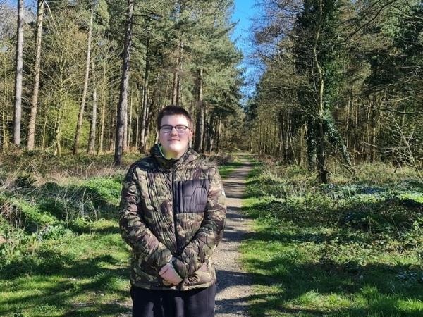 Teenage boy in woods