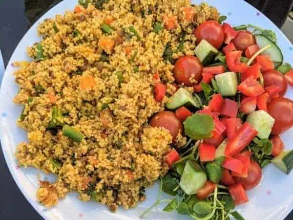 A plate of food with Salad and Couscous