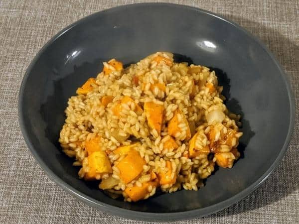 Butternut squash risotto in black dish