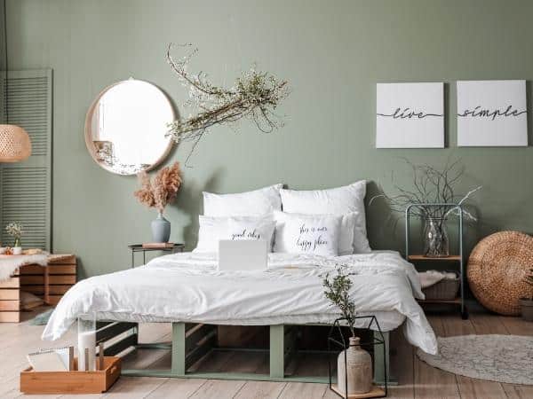 A bedroom with a bed and a table in a room