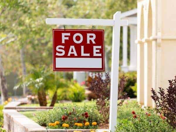 A sale sign in front of a building