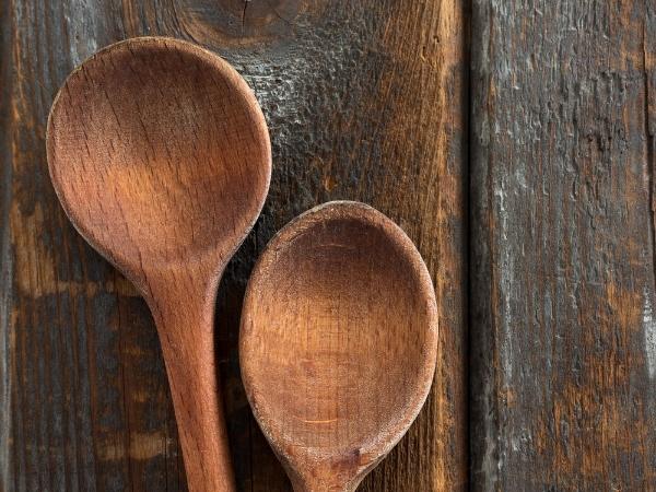 A close up of a brown wooden spoon