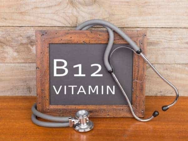 vitamin b12 on a black board in a frame with stethoscope.