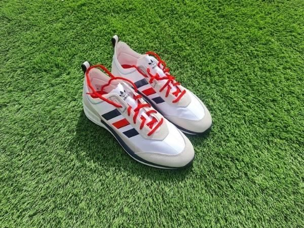 Blue white and red adidas shoes