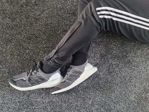 boys legs with tracksuit bottoms and trainers from adidas