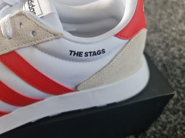 close up of personalised adidas shoes with The Stags on for Mansfield Town trainers